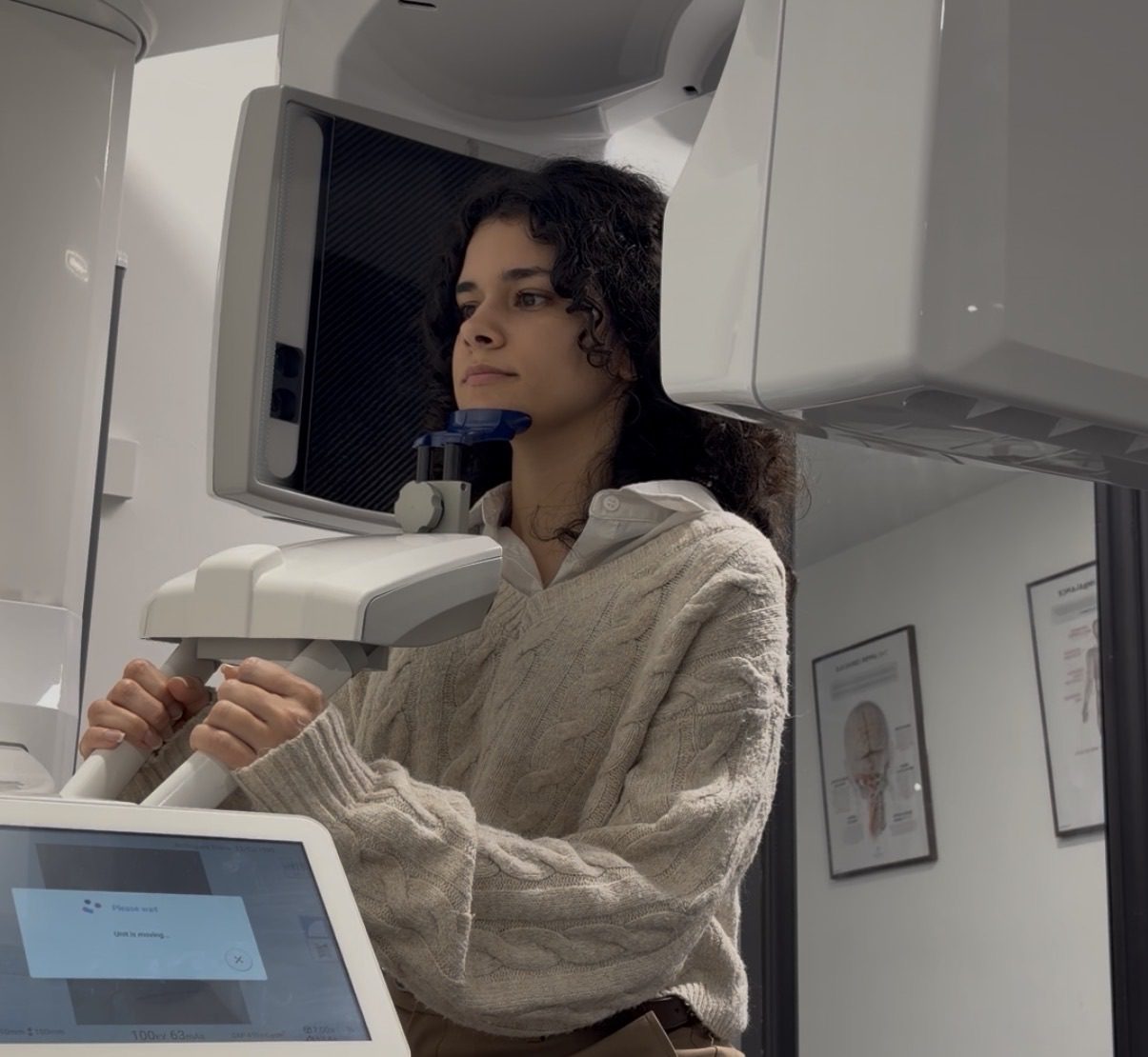 Client in a CBCT machine for a upper cervical spine scan.