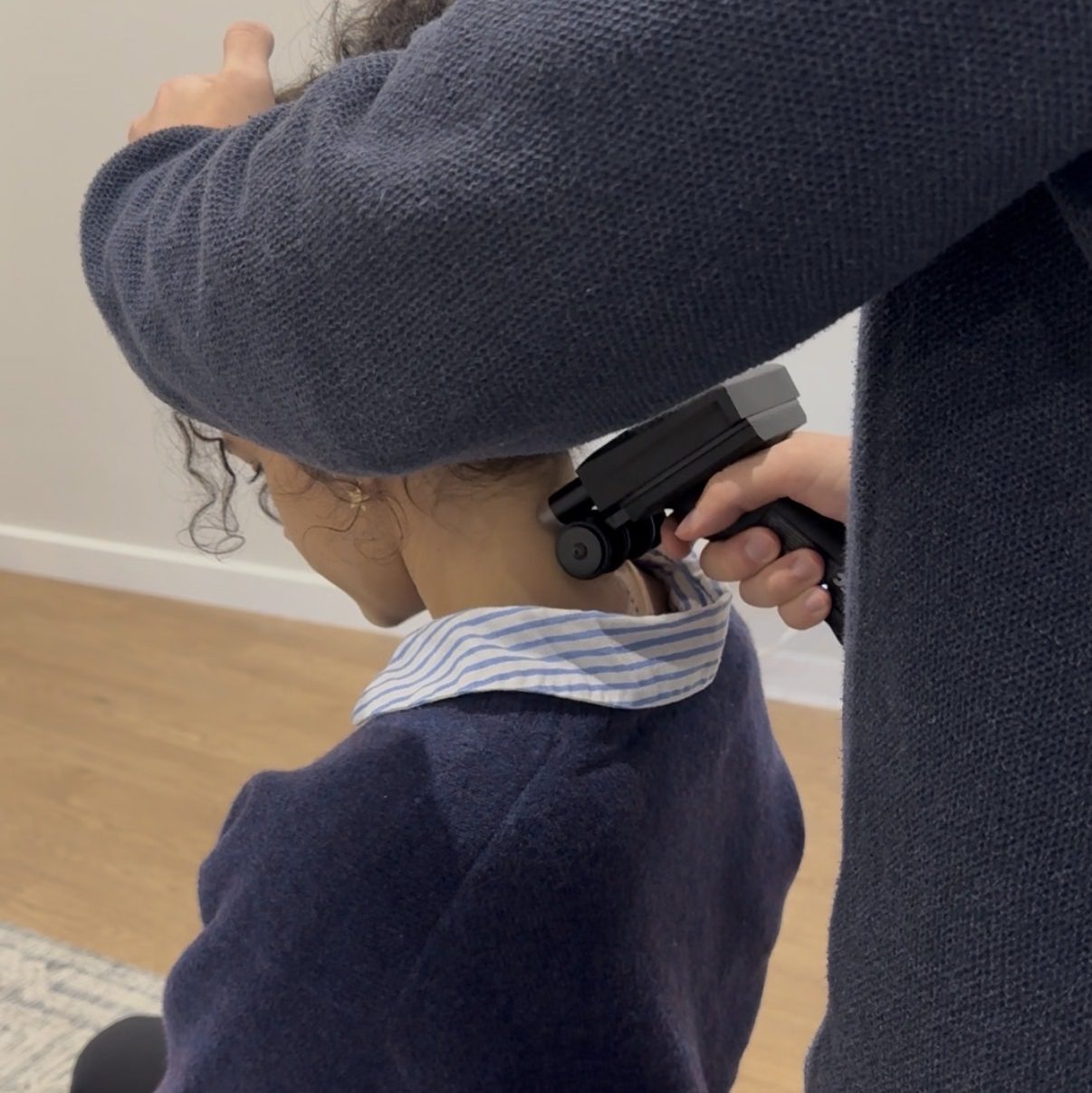A chiropractor performing a non-invasive thermal nervous system assessment